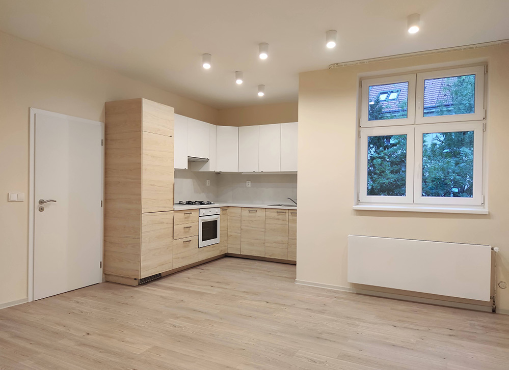 modern kitchen with wooden decor and white cabinets