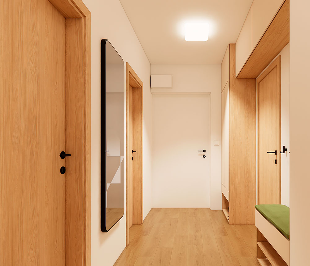Návrh vstupní chodby v bytě s úložnými skříněmi, zrcadlem a jednotným materiálovým řešením